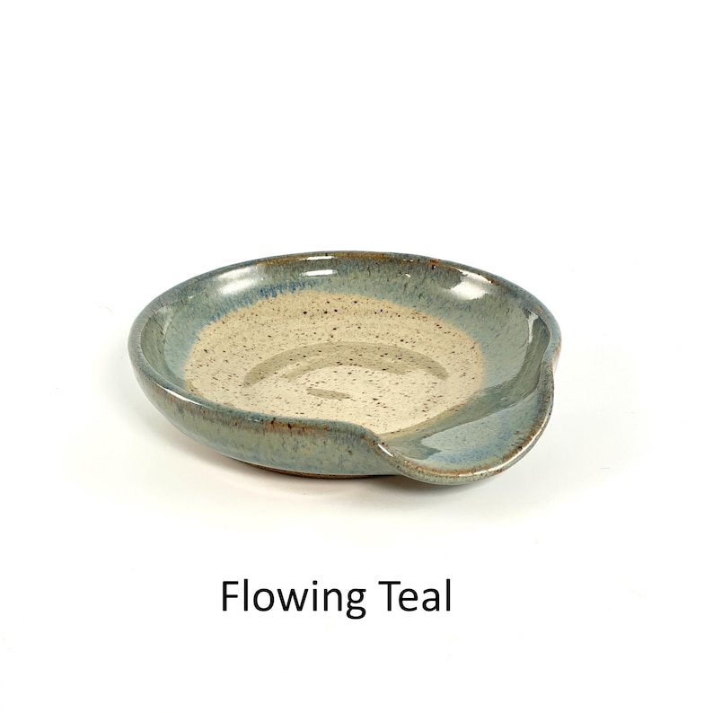 Flowing Teal handcrafted spoon rest, shallow round shape with notch for spoon handle, formed on a potter's wheel.