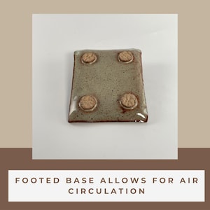 The footed base of a Soap Dish is showing words stating:
Footed base allows for air circulation.
