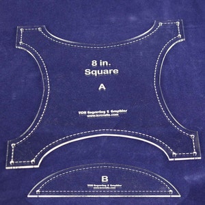 May include: Clear acrylic quilting templates. The larger template is an 8-inch square with curved edges and the text "8 in. Square A". A smaller, curved template is below it. Both have dotted lines for stitching guides and the text "TOR Engraving & Graphics".