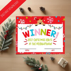 May include: A red Christmas certificate with the word "WINNER!" in large, colorful letters. The certificate features a reindeer graphic and the text "Best Christmas lights in the neighborhood!" with space for signatures and dates.