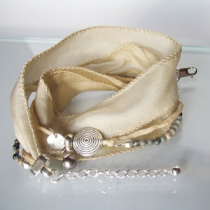 Silk bracelet with silver snail and freshwater pearl