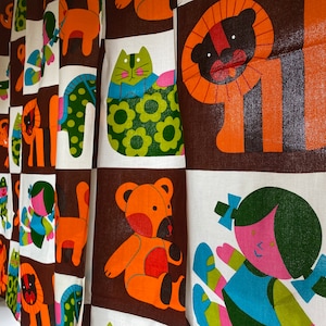May include: A brown and white fabric with a repeating pattern of colorful animals and people. The animals include a lion, a bear, a cat, and a horse. The people are wearing colorful clothes and have different hairstyles.