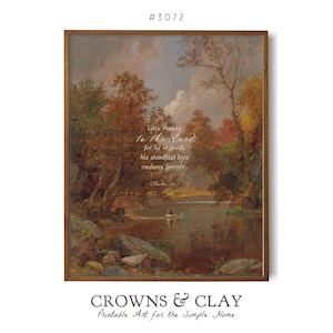 May include: A printable art print featuring a painting of a forest scene with a river in the foreground. The print includes a quote from the Bible: "Give thanks to the Lord, for he is good; his steadfast love endures forever."  The print is framed in a brown wood frame.