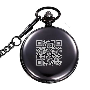 May include: A black pocket watch with a silver chain. The watch face has a black and white QR code engraved on it.