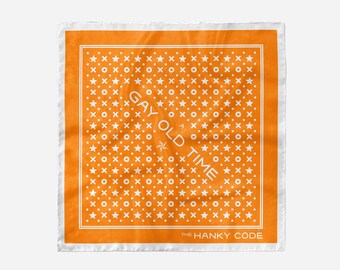 May include: Orange bandana with a white pattern of stars, circles, and crosses. The text "GAY OLD TIME" is printed in white in the center of the bandana. The text "THE HANKY CODE" is printed in white at the bottom of the bandana.