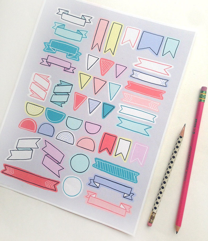 May include: A sheet of colorful printable stickers featuring various shapes and designs, including banners, flags, circles, and semi-circles. The stickers are perfect for adding a touch of whimsy to planners, journals, and other paper crafts.