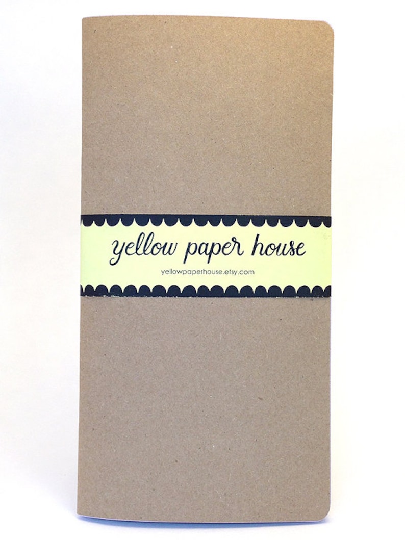 May include: A brown notebook with a yellow and black label that says "yellow paper house" and "yellowpaperhouse.etsy.com".