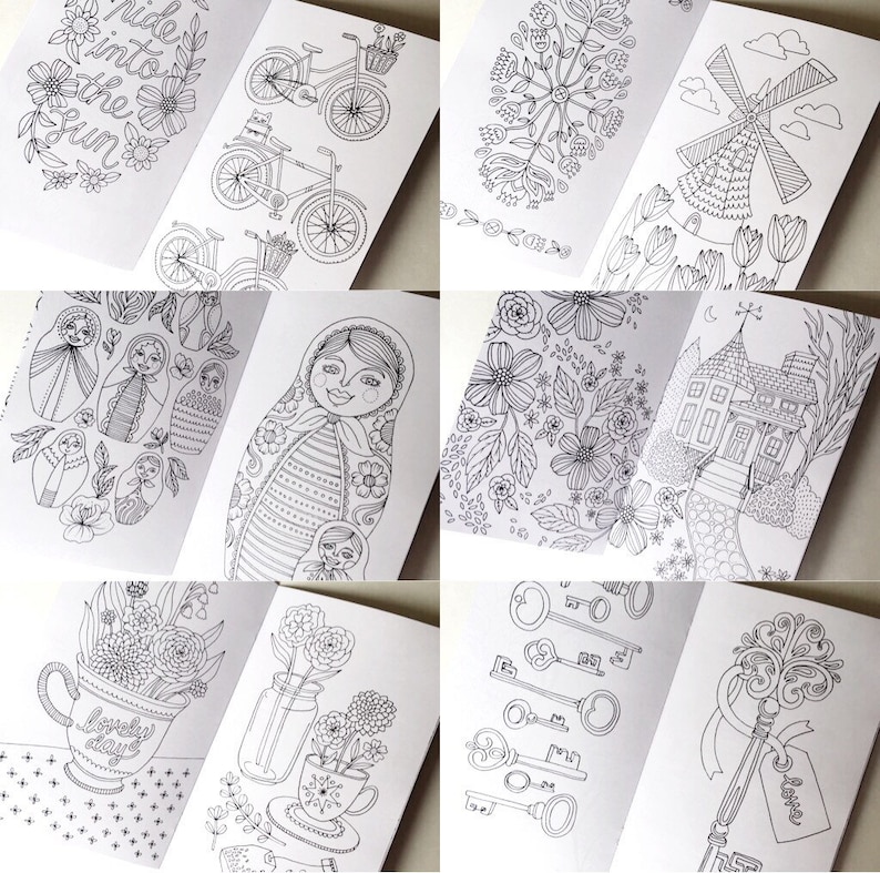 May include: A colouring book featuring black and white illustrations of various themes, including bicycles, flowers, a windmill, a house, a teacup, and keys. The book is open to different pages, showcasing the diverse designs.