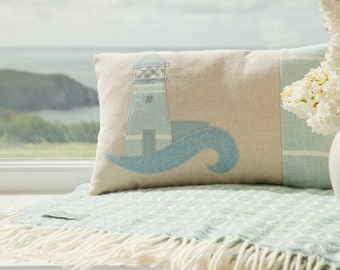 Lighthouse cushion in pastel slatey blue cotton and linens.