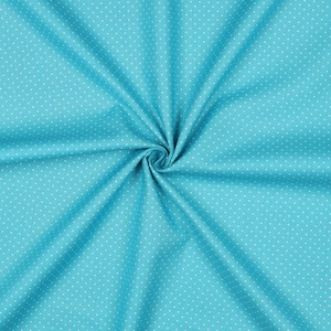Op de afbeelding: Een close-up van een turquoise stof met een wit stippenpatroon. De stof is gevouwen en heeft een textuur.