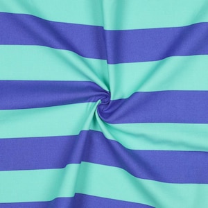 May include: A fabric with alternating stripes of teal blue and purple. The fabric is folded and twisted, showing the texture of the material.