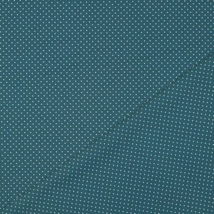 Op de afbeelding: Een teal stof met een wit stippenpatroon. De stof is doormidden gevouwen, waardoor een diagonale lijn ontstaat.