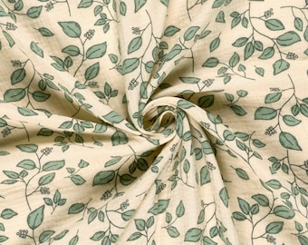 May include: A piece of cream-colored fabric featuring a repeating pattern of sage green leaves and small berries on thin, dark brown stems. The textile has a crinkled, textured surface with folds that create a sense of depth and movement.