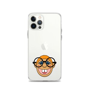 May include: A clear phone case with a cartoon illustration of a smiling character with orange hair, blue eyes, and glasses. The character has a large toothy grin.