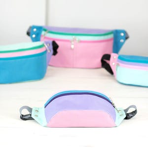 A unisex belt bag featuring a bottom panel.