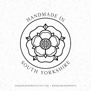 May include: Black and white illustration of a rose inside a circle with the text "Handmade in South Yorkshire".