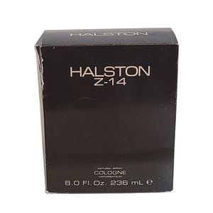 May include: A black box of Halston Z-14 cologne. The brand name and product name are in white lettering. The box also indicates the cologne is a natural spray and contains 236 ml.