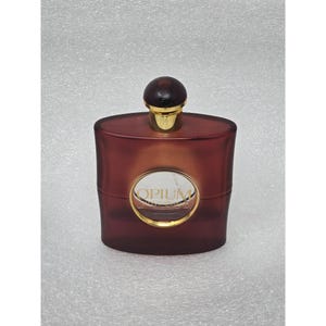 Collier Pendentif YSL Parfum OPIUM - Doré Avec Cordon Violet (Occasion)