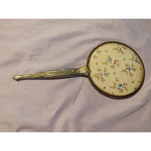 Vintage Handheld Gold Tone Vanity Mirror With Floral Patterned Back