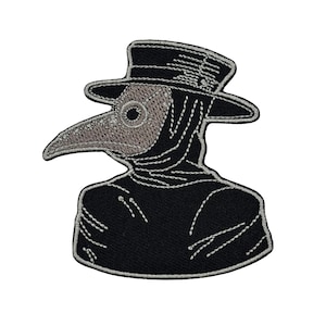 May include: Embroidered patch featuring a black plague doctor with a long beak and a hat. The doctor's mask is a light gray color, and the design is outlined with white stitching. The patch is likely for clothing or accessories.