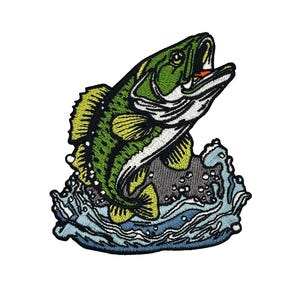 May include: Embroidered patch featuring a leaping green and black bass fish with an open mouth, a red lure, and white accents. The fish is jumping out of blue and white water. The patch is on a white background.