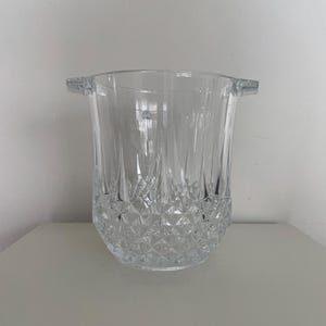 May include: A trio of ceramic mugs with a speckled, matte finish in cream, light grey, and dark grey. Each mug features a simple, minimalist design, ideal for tea or coffee.