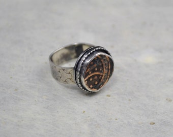 Wide patterned square sterling silver band ring with old copper coin.