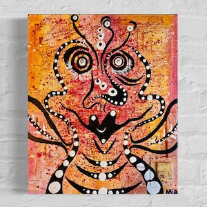 May include: Abstract painting of a face with black and white details on a red, orange, and yellow background. The painting is signed "MIA" in the bottom right corner.