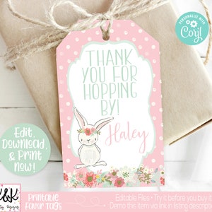May include: Pink and green printable favor tag with a white bunny wearing a flower crown. The tag says "Thank you for hopping by!" and has the name "Haley" written in pink.