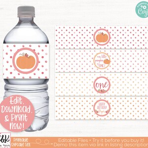 May include: Printable water bottle labels with a pink and orange polka dot pattern. The labels feature a pumpkin design and the text "our little pumpkin is one!" and "one".
