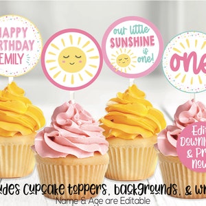 May include: Four cupcake toppers with a sunshine theme. The toppers feature a yellow sun with a smiling face and pink, yellow, and blue confetti. The text on the toppers reads "Happy Birthday Emily", "Our little Sunshine is one!" and "one".