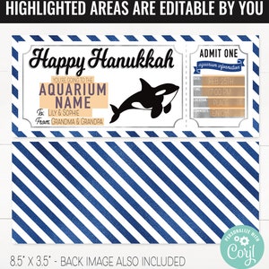 K&ouml;nnte beinhalten: Druckbarer Happy Hanukkah-Gutschein f&uuml;r einen Aquarium-Besuch. Der Gutschein ist silberfarben mit blauen Streifen und zeigt eine schwarz-wei&szlig;e Orca. Der Text auf dem Gutschein lautet "Happy Hanukkah", "You're going to the Aquarium", "To: Lily & Sophie", "From: Grandma & Grandpa", "Admit One", "Aquarium Information", "Date: Feb. 25th", "Time: 7:00 PM", "Location: Place", "Comments: Enjoy!!!".
