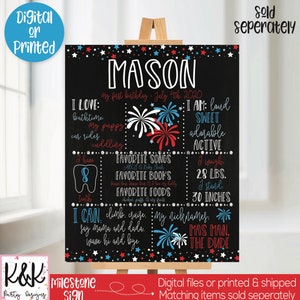 May include: A black chalkboard sign with a red, white, and blue patriotic theme. The sign says "Mason" and includes details about the child's first birthday, including their age, weight, height, favorite songs, books, and foods. The sign is decorated with stars and fireworks.