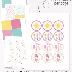 May include: Printable set of cupcake wrappers and toppers featuring a sun with a smiling face and the text "our little sunshine one!" in pink, yellow, and blue. The set also includes a printable sheet with a pink, yellow, and blue polka dot pattern.