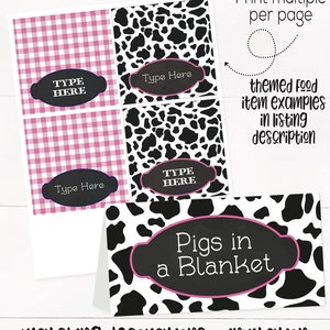 May include: Printable food labels with a cow print design. The labels have a pink and black color scheme and say "Type Here" and "Pigs in a Blanket".