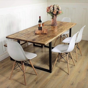 solid wood industrial reclaimed dining table with steel base