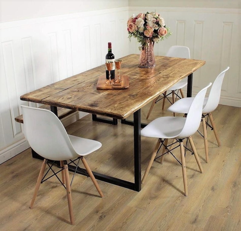 solid wood industrial reclaimed dining table with steel base