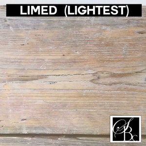 May include: A close-up of a light-toned wood surface with a whitewashed finish. The wood has a natural grain pattern and is slightly weathered. The text "LIMED (LIGHTEST)" is displayed at the top of the image.