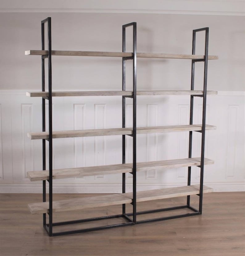 May include: A black metal bookshelf with five wooden shelves. The shelves are made of light-colored wood and are evenly spaced.