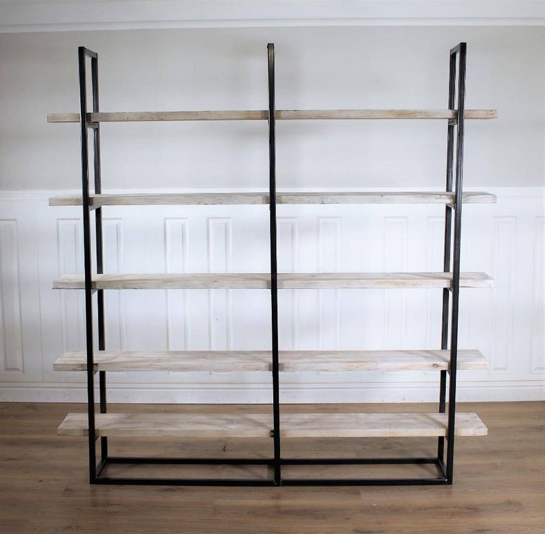 May include: A black metal bookshelf with five wooden shelves. The shelves are a light wood color with a whitewashed finish.
