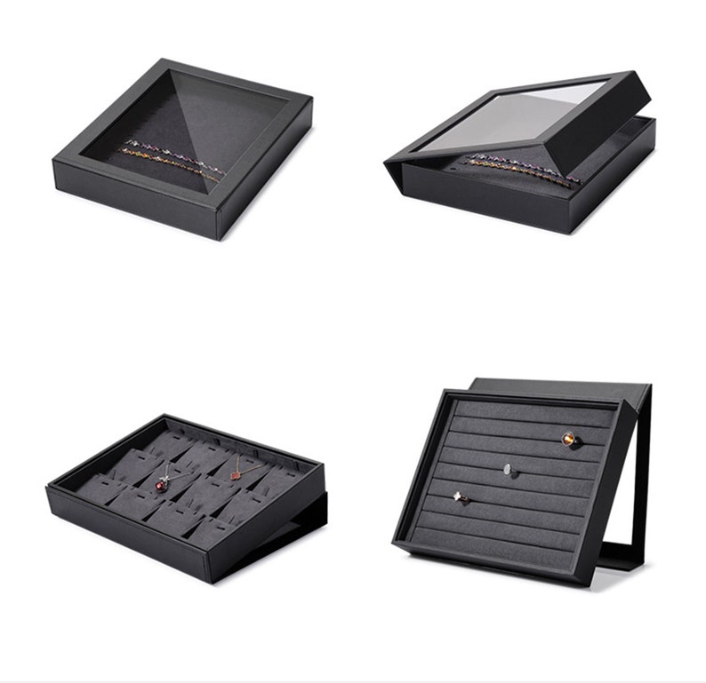 Puede incluir: Cuatro cajas de joyer&iacute;a negras con diferentes compartimentos para guardar collares, pendientes y anillos. Las cajas est&aacute;n hechas de un material resistente y tienen un dise&ntilde;o elegante y moderno.