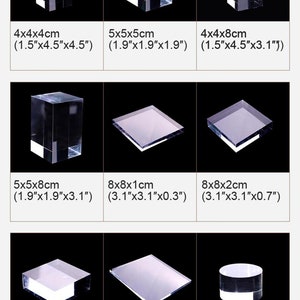 May include: A set of clear acrylic display blocks in various sizes, perfect for showcasing small items. The blocks range in size from 1.5 inches to 7.8 inches and are ideal for displaying jewelry, figurines, or other small objects.