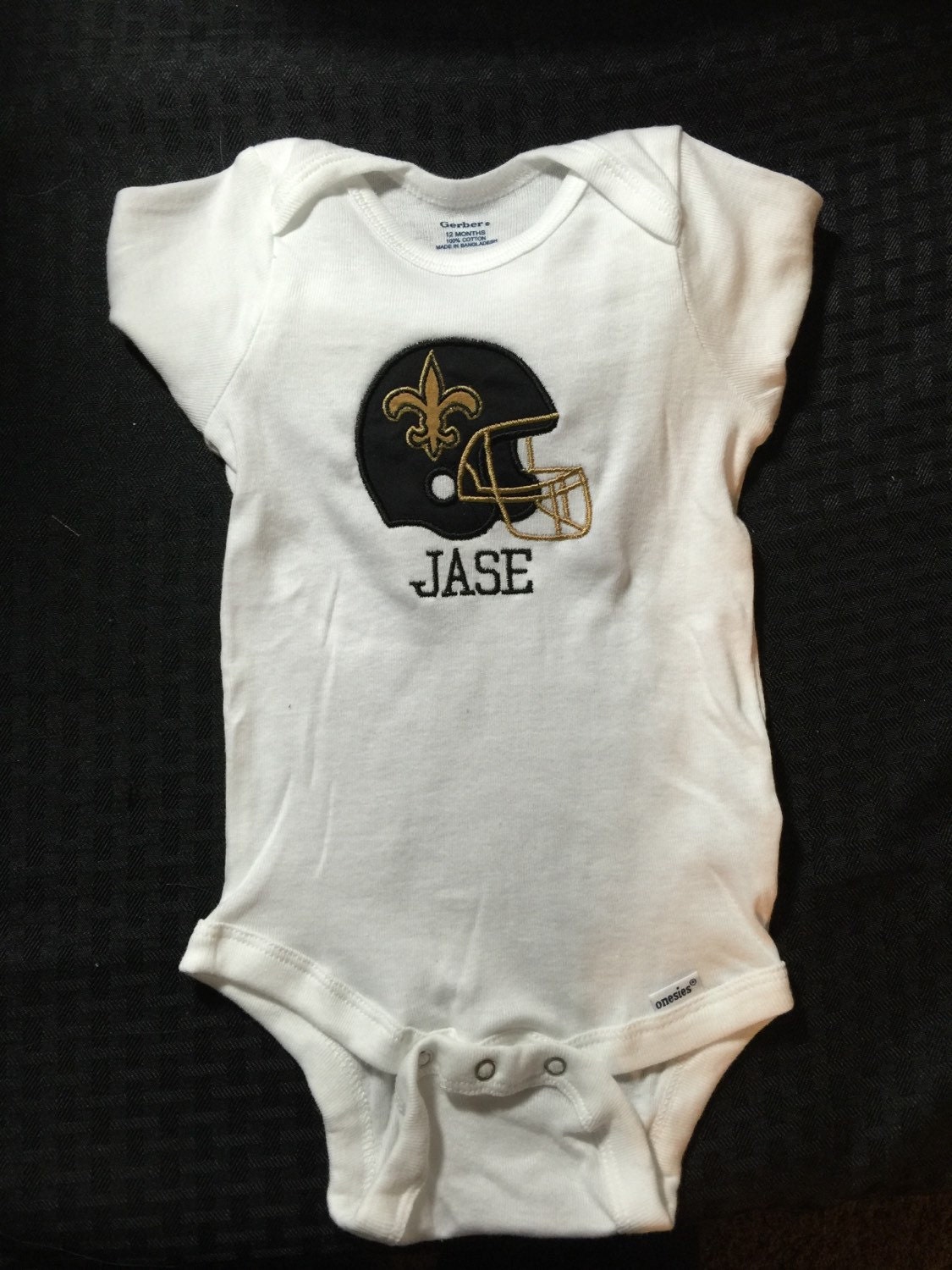 saints baby onesie