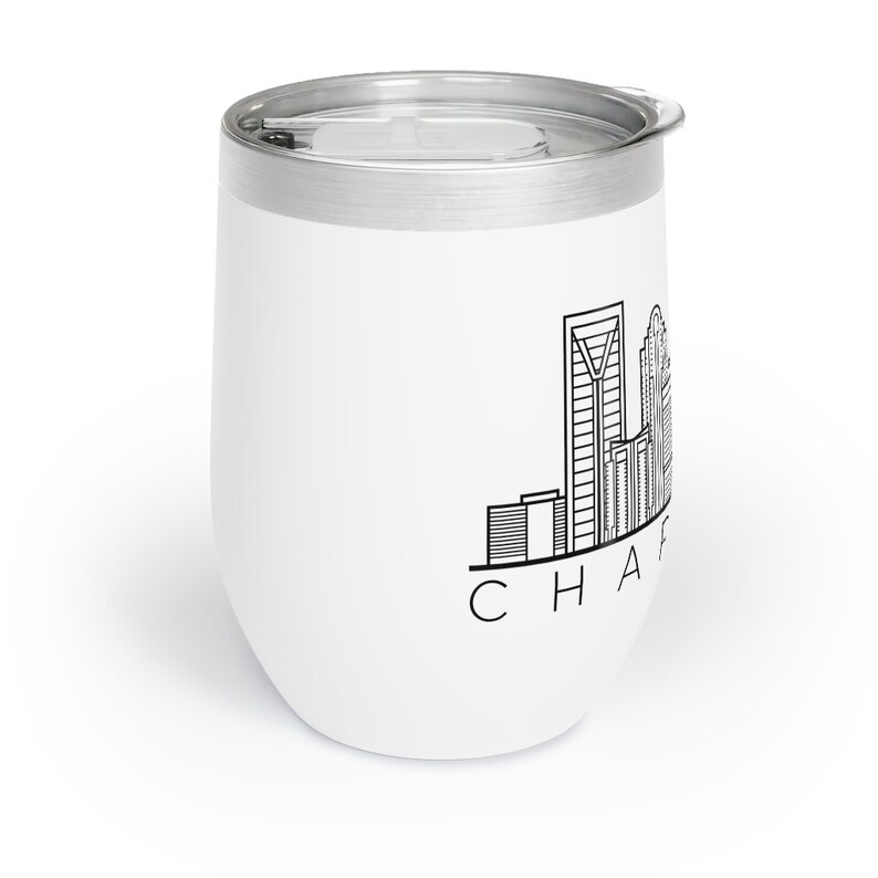 May include: White stainless steel tumbler with a black outline of the Charlotte, North Carolina skyline and the text "CHARLOTTE" underneath.