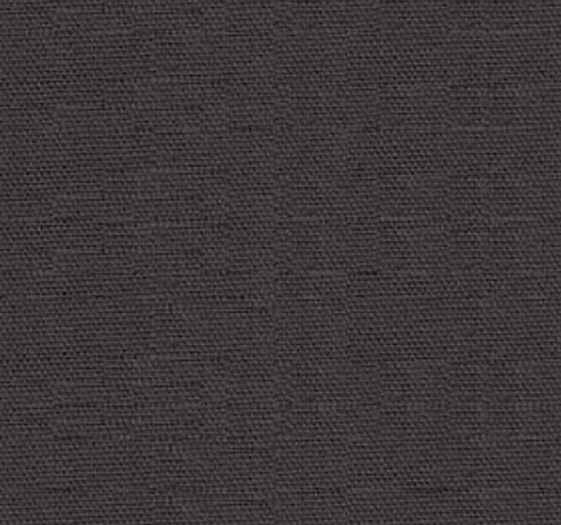 May include: A dark gray textured fabric with a subtle woven pattern.