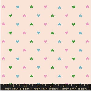 May include: A fabric with a repeating pattern of small hearts in green, blue, and pink on a light peach background. The text "RUBY STAR SOCIETY" is printed along the bottom edge.