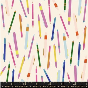 May include: A cream-colored fabric with a repeating pattern of colorful pens. The pens are in shades of pink, blue, green, yellow, and orange. The text "RUBY STAR SOCIETY" is printed along the bottom edge of the fabric.