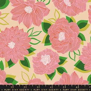 May include: A peach-colored fabric with a repeating pattern of pink flowers and green leaves. The flowers have a detailed, layered design and the leaves are a solid green.