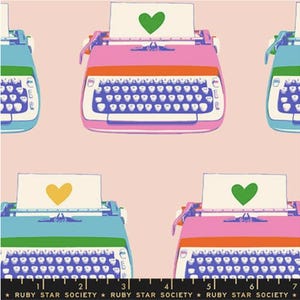 May include: A repeating pattern of colorful typewriters on a light pink background. The typewriters are in shades of pink, blue, and green, each with a sheet of paper featuring a heart. The text "RUBY STAR SOCIETY" is at the bottom.