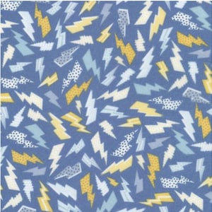 May include: A blue fabric with a repeating pattern of yellow, white, and light blue lightning bolts. Some bolts have polka dot and striped details. The bolts are scattered across the fabric.